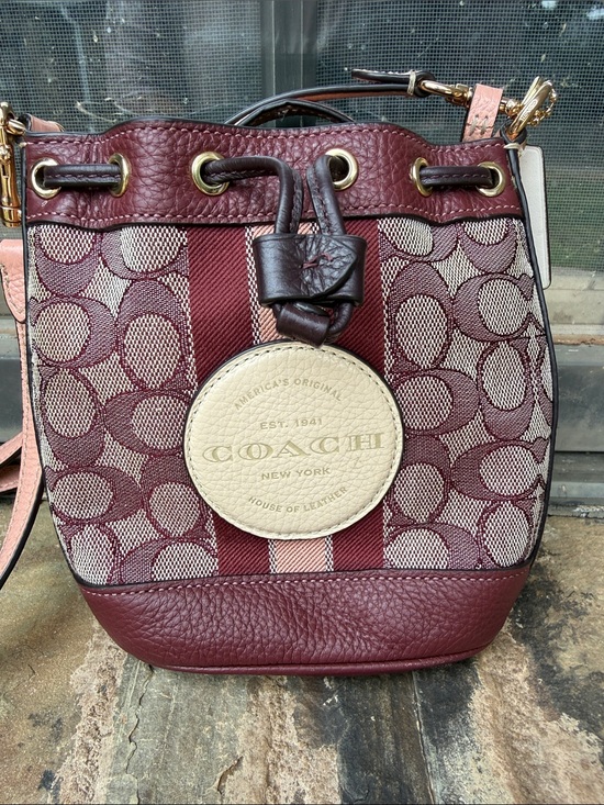 Coach Handbags - Coach Burgundy Signature Stripe Drawstring Crossbody with Cream Medallion